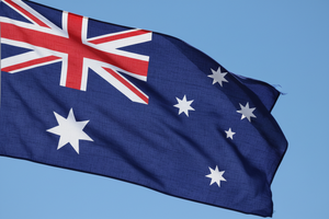close up picture of waving australian flag in the sky
